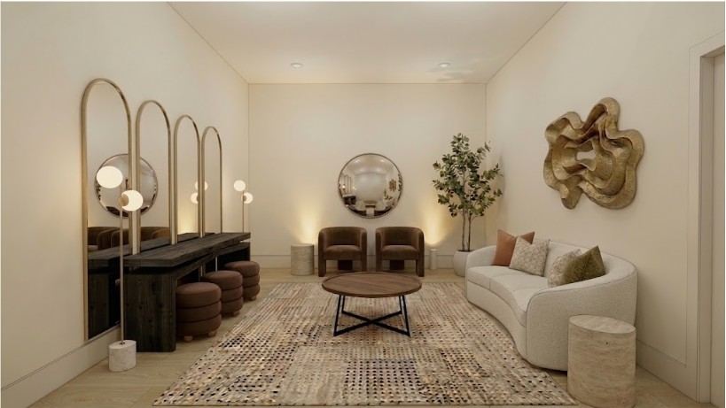 The bride's room with lighted vanities, a round mirror, and lounge seating