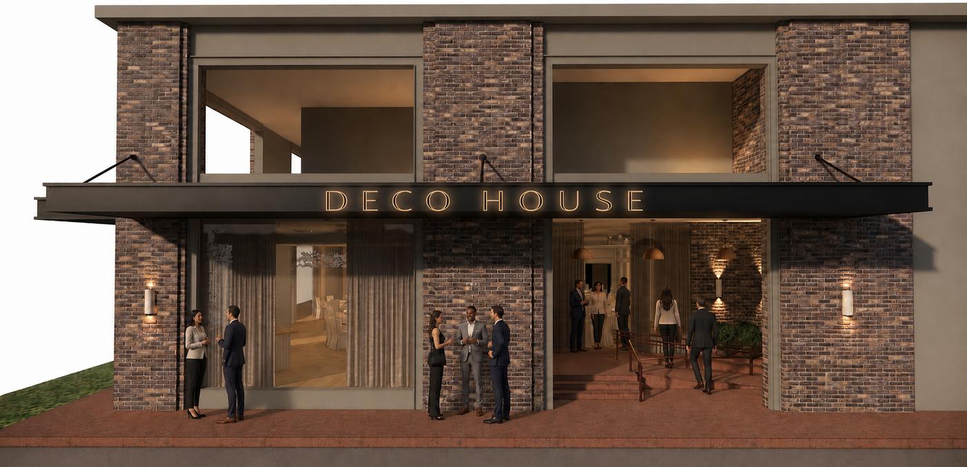 The Deco House facade in daylight, showing the brick exterior and brass marquee above the entrance